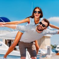 Man and woman pretending to fly after drinking an energy drink