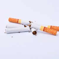 Broken cigarette isolated on white background