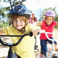 Children out for a bike ride with their parents getting exercise