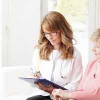Senior woman in consultation with her doctor about a pap smear