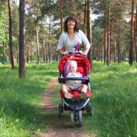 Mother enjoying some exercise pushing a baby in the stroller