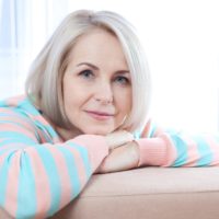 Middle aged woman relaxing at home