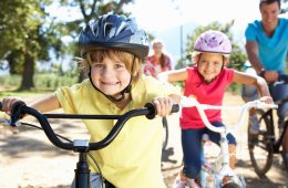 Children out for a bike ride with their parents getting exercise