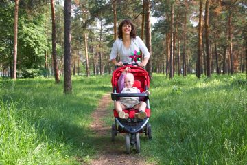 Mother enjoying some exercise pushing a baby in the stroller