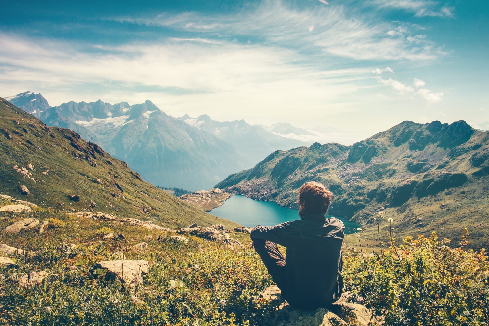 Man relaxing with serene view mountains and lake landscape - Your Health