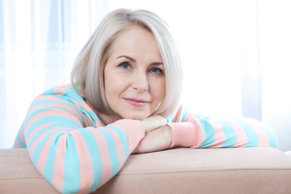 Middle aged woman relaxing at home