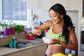 Woman healthy eating strawberry